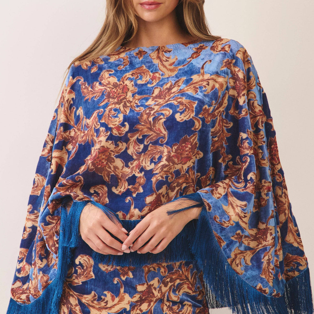Ornate floral print fringe trim poncho top